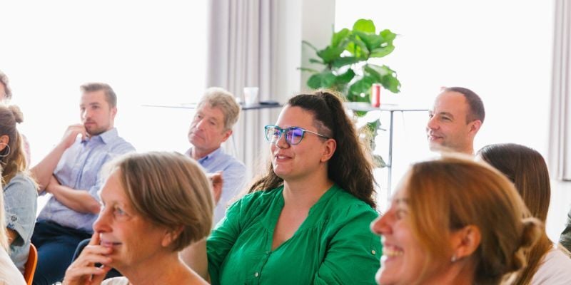 audience AdminPulse employees laughing